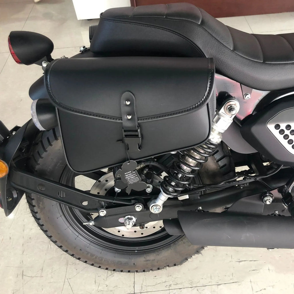 Black PU leather motorcycle swingarm bag mounted on Harley Sportster for tool storage