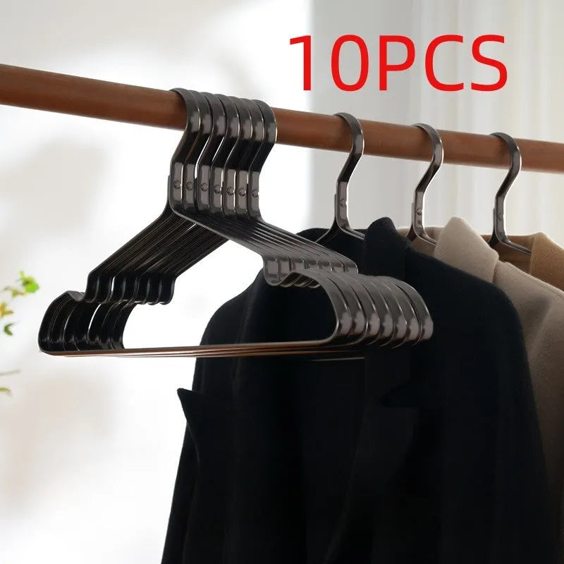 Elegant black modern clothes hanger with non-slip shoulders on a white background.