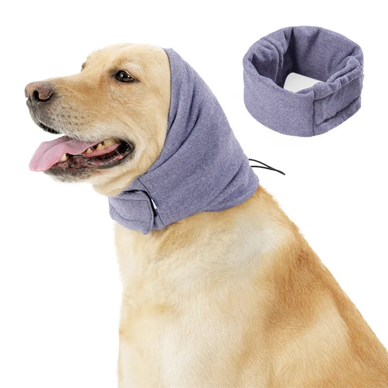 A black dog wearing a purple polyester calming hoodie that covers its head and ears.