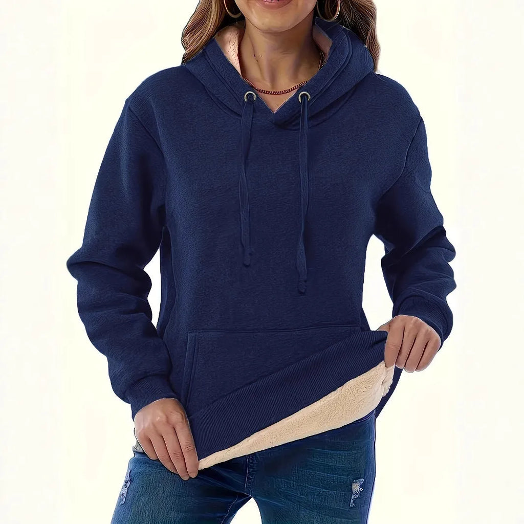 Women's loose black hooded sweater with pockets and a textured 3D pattern
