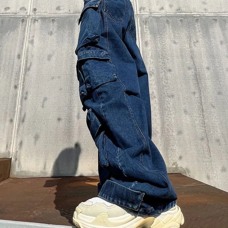 Dark blue wide-leg distressed jeans with high waist and multiple pockets on a mannequin