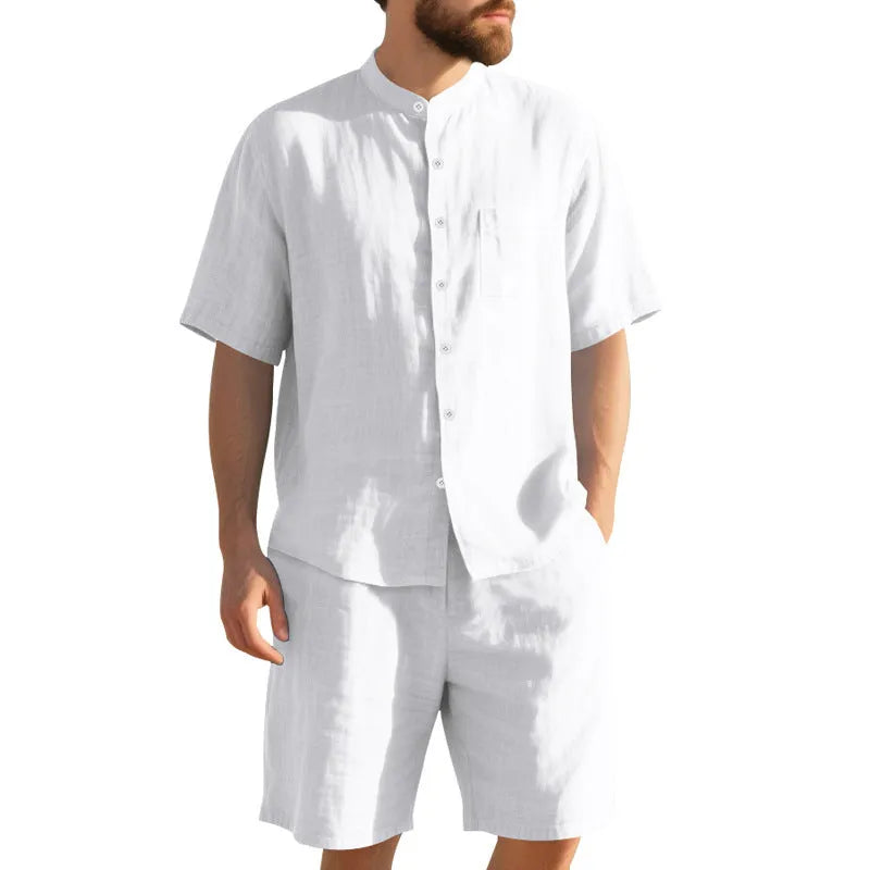 Men's light blue linen blend summer suit with henry collar shirt and shorts on a hanger.