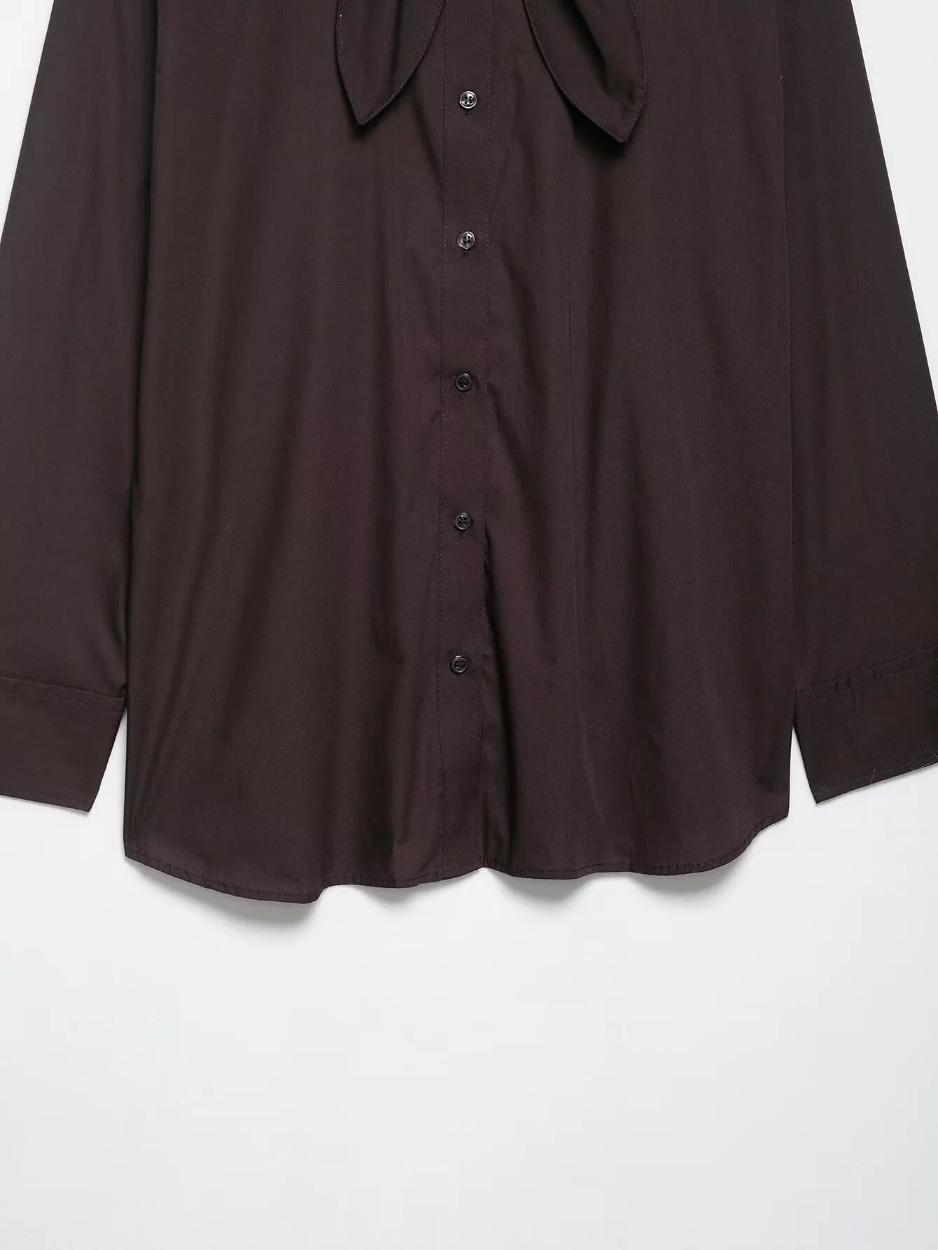 Brown women's loose fit poplin shirt with long sleeves and an integrated bow tie scarf at the neck.
