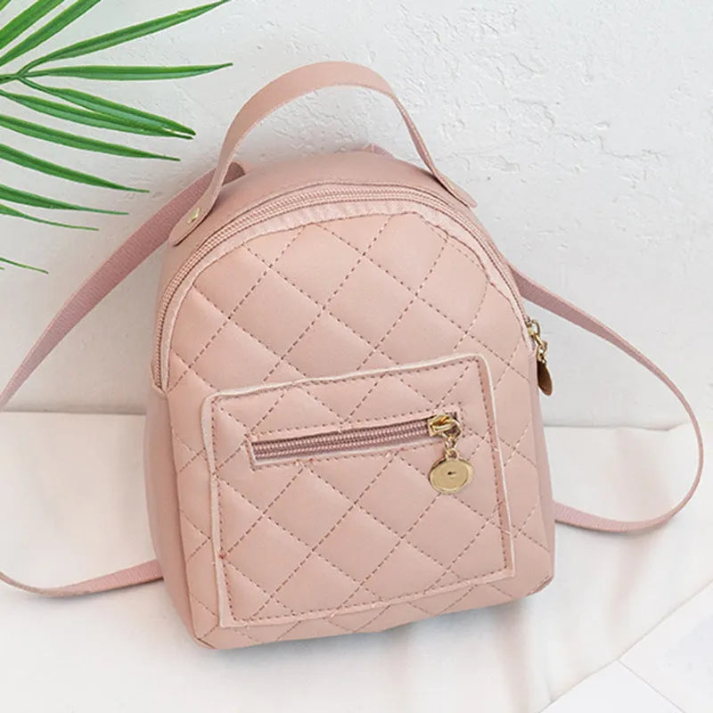 Hardback white PU girls backpack with embroidery, showing front sandwich pocket and soft carry handle.