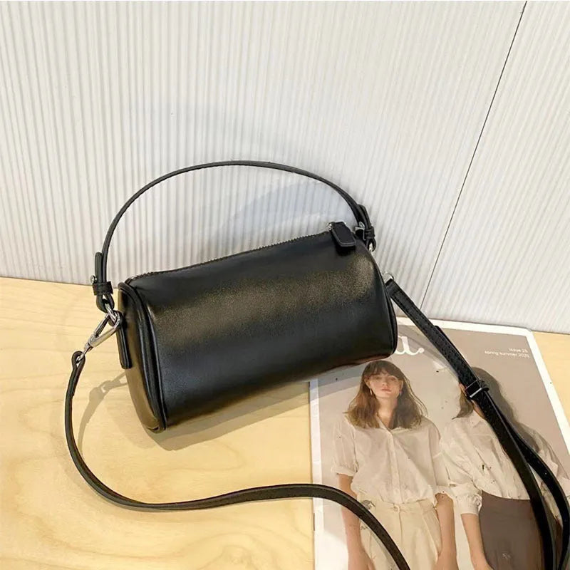 Cylindrical leather crossbody phone bag in vegetable tanned genuine leather with sewing thread detailing