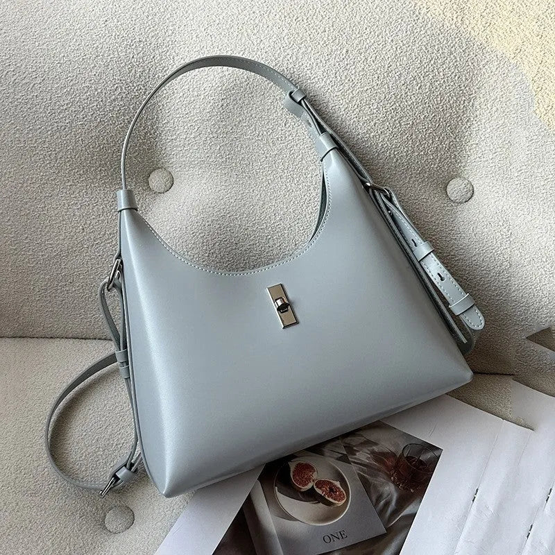 Soft genuine leather dumpling-shaped crossbody shoulder bag in a street style with lock detail