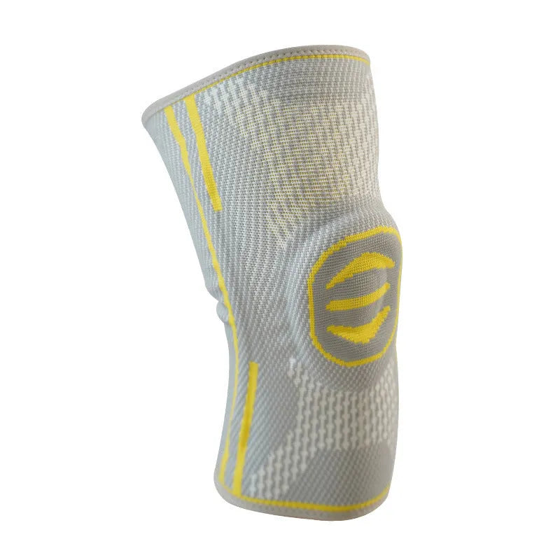 A pair of cotton mountaineering knee pads in blue, shown on a knee.