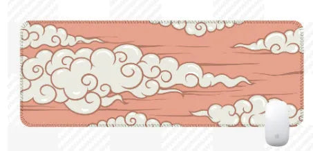 Large cloud pattern mouse pad with non-slip rubber base on a desk