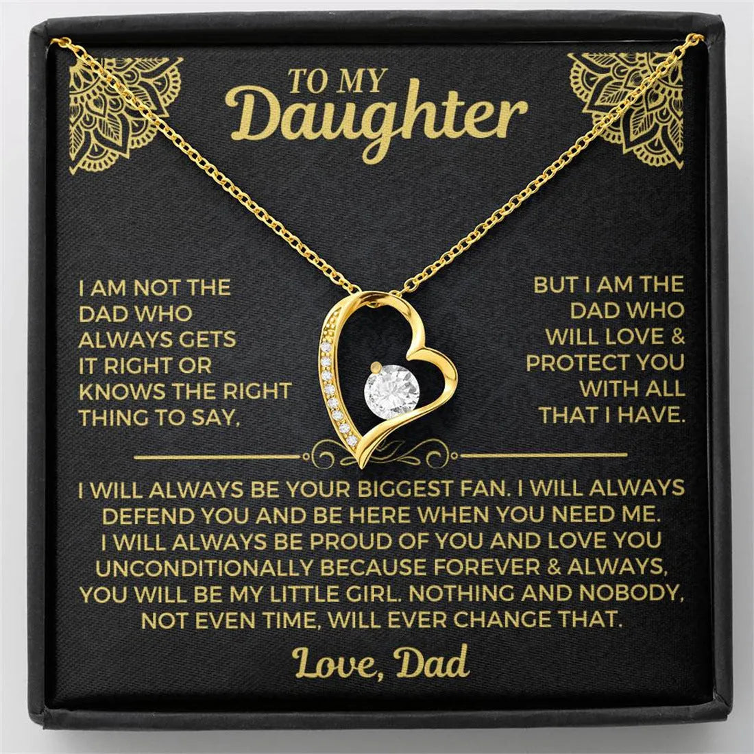 Silver and gold hollow heart necklace pendant presented on a card inside an open gift box.
