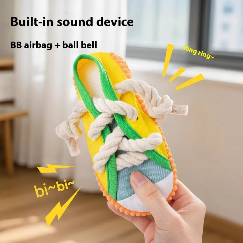 A bendable plastic dog slippers squeaker toy in yellow, black, or blue for chewing and play.