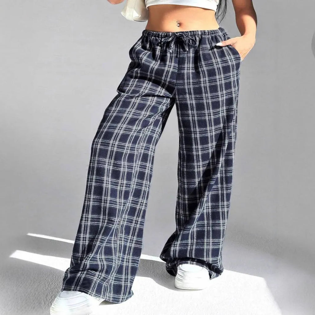 Women's blue and red plaid casual trousers with drawstring waist and side pockets.