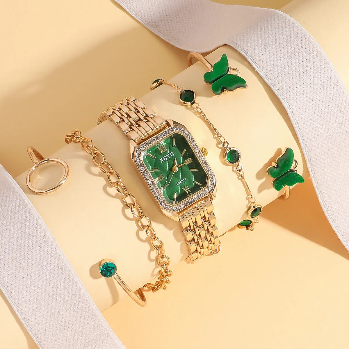 Women's gold green square watch with four matching bracelets in gift set packaging