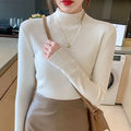 Women's slim fit viscose knitted long sleeve pullover top in apricot colour.