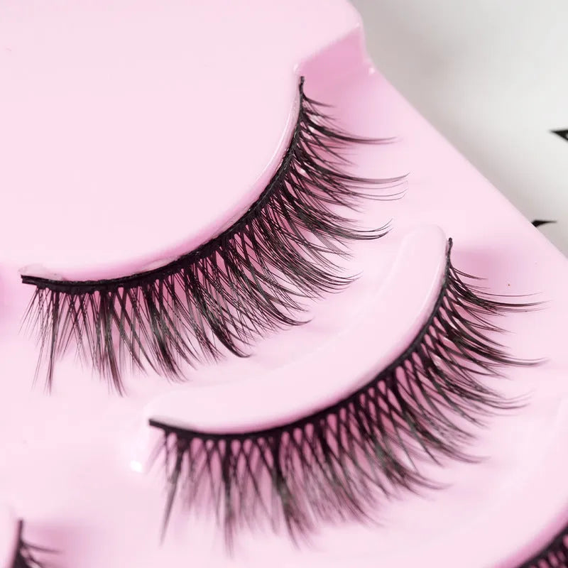 Pack of 5 pairs of black manga-style false eyelashes with natural wispy length on a white background.