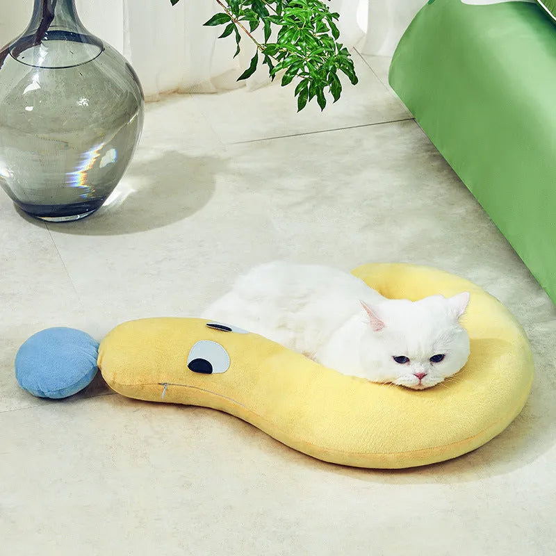 A rectangular blue or yellow pet pillow for cats and dogs, measuring 62cm by 39cm.