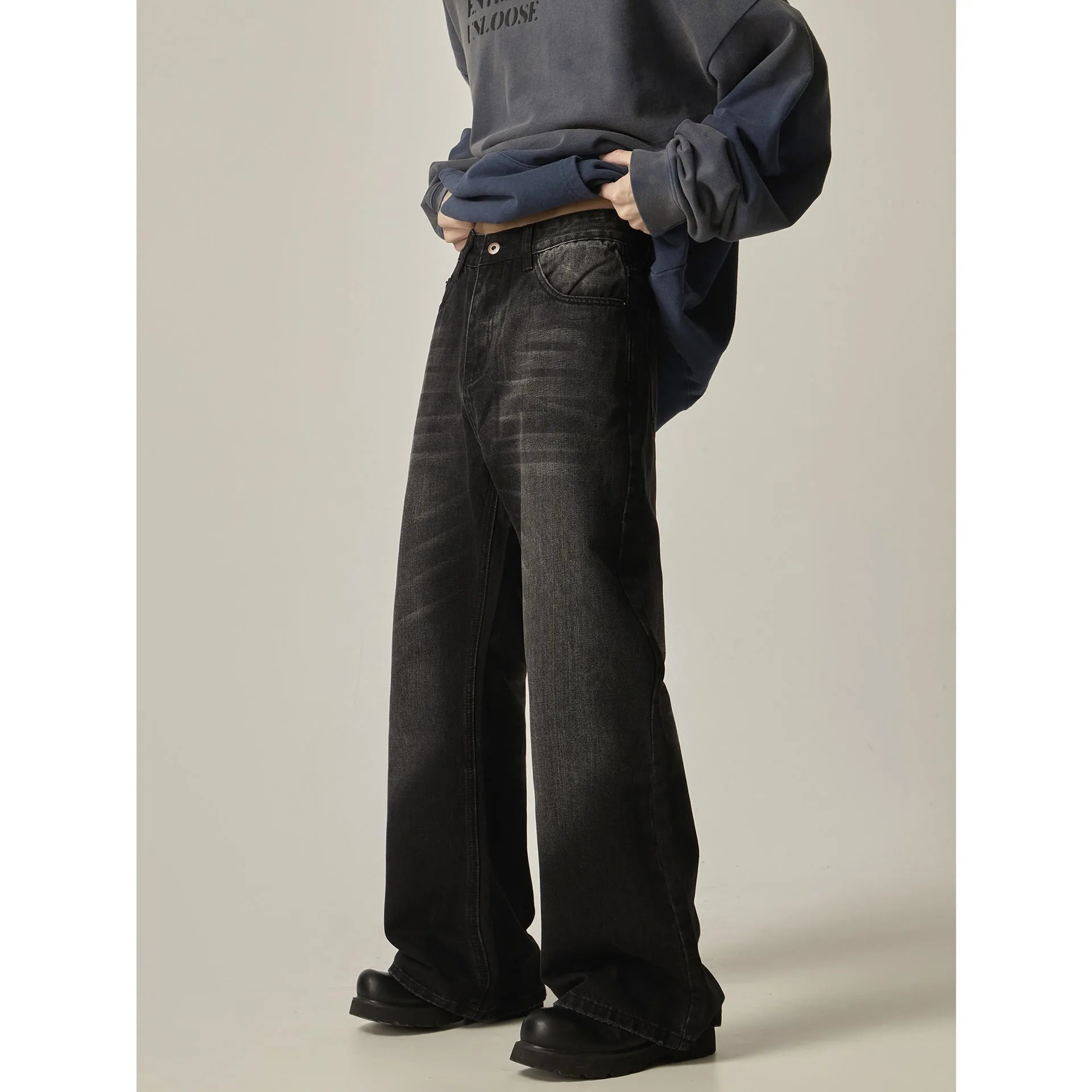 Black loose straight-leg American retro jeans with zipper fly on mannequin