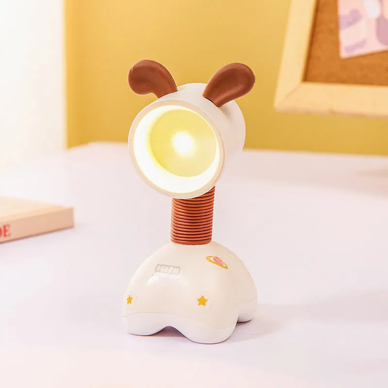 DIY magnetic cartoon small night lamp with multi-angle adjustable lighting on desktop