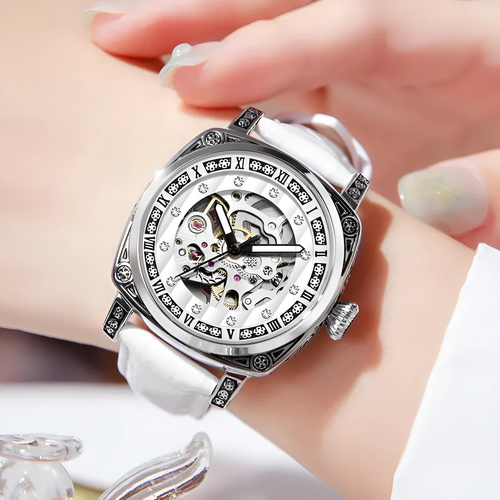 Men's mechanical watch with luminous hands on a leather strap, showing black, red, steel, and white colour options.