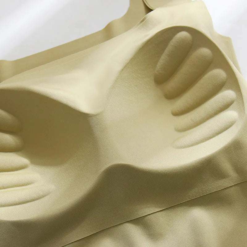 Seamless nylon sling vest for women with built-in thin full cup, shown in a light colour.