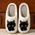 White plush couple slippers with black beard cat cartoon design and non-slip soles.