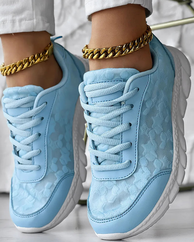 Women's canvas running shoes in white with round toe and flat heel design