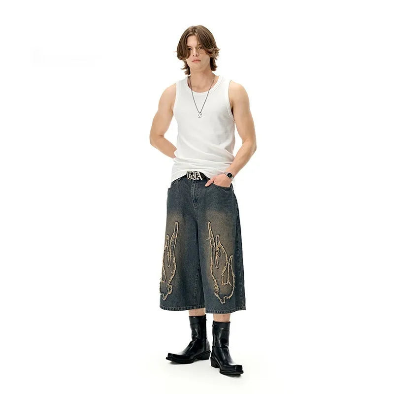 Men's cropped denim shorts with flame embroidery patch in straight leg cut