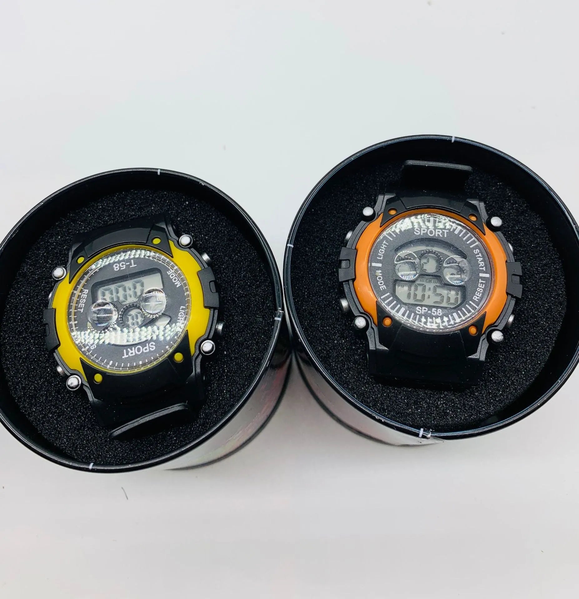 Children's digital sports watch with mixed colour silicone strap and plastic case showing alarm and calendar functions