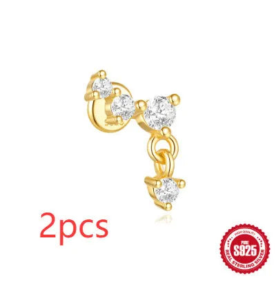 S925 sterling silver geometric moon and star earrings with diamond detail on a gold tone background.
