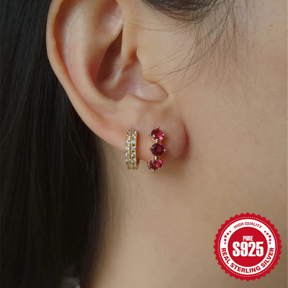 A pair of S925 sterling silver geometric earrings featuring a sunflower design with inlaid golden zircon stones.