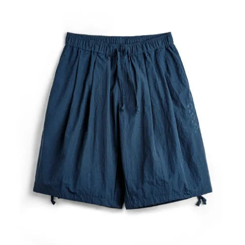 Men's loose fit beach shorts with embroidered design in Prussian Blue colour