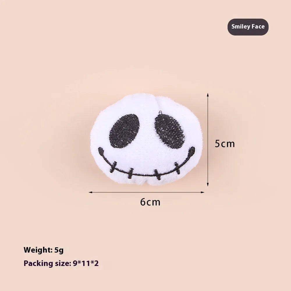 Small plush cat teaser wand with candy and skull designs for indoor play