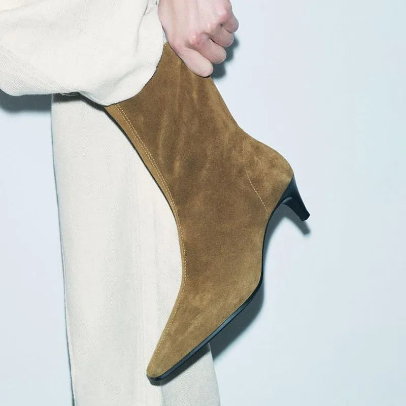 Brown women's square toe ankle boots with a side zipper and stiletto heel on a waterproof platform sole.