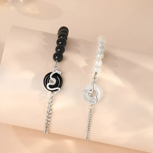 925 sterling silver couple bracelet with safe buckle, snake zodiac design, and obsidian pearl details in New Chinese style.