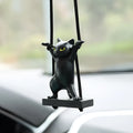 Cartoon-style resin cat pendant on an adjustable rope for car interior decoration.