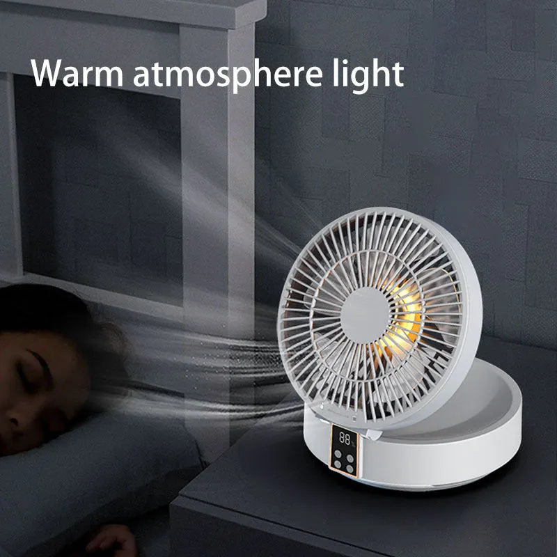 White portable rechargeable folding fan with remote control and warm night light on a desk