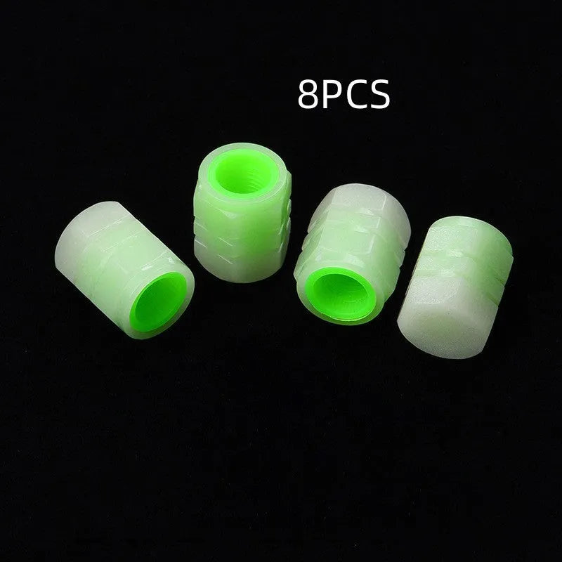 Glow-in-the-dark rubber car tyre valve caps in a set, showing size and luminous feature.