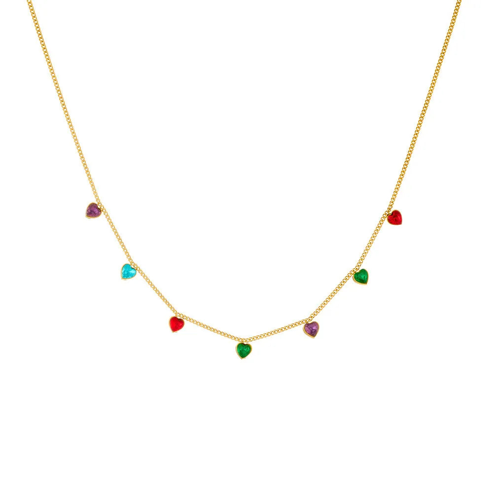 Gold heart pendant necklace on a stainless steel chain with adjustable length.