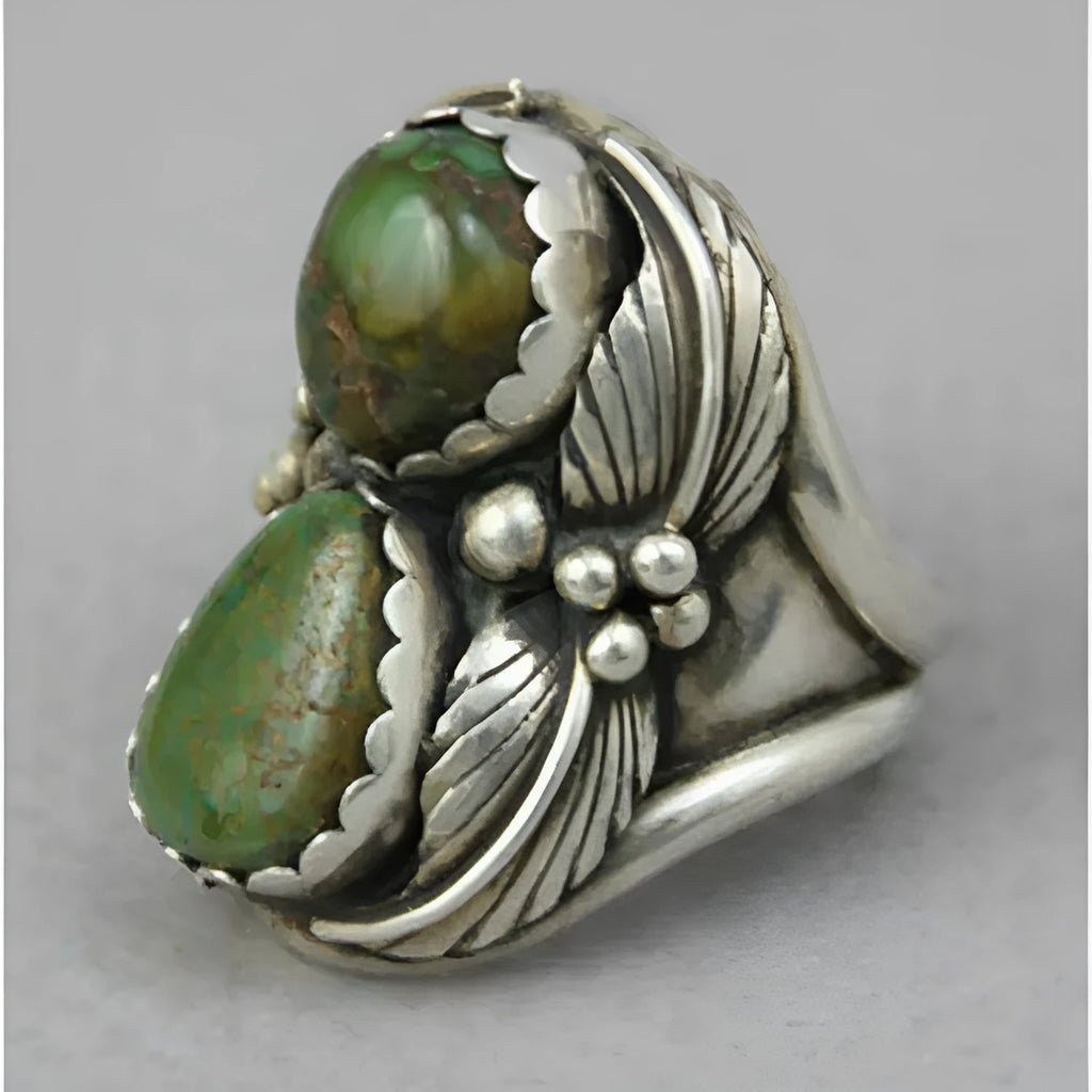 Geometric turquoise women's ring with inlaid detail on alloy band, showing side profile