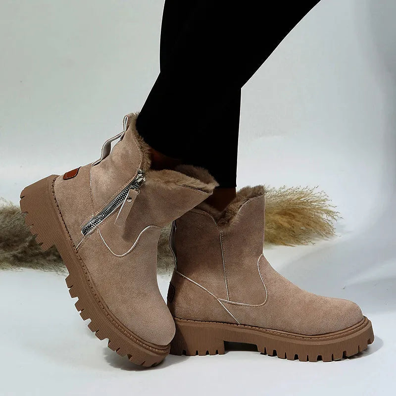 Women's black high-top snow boots with side zipper and round toe, made from cow suede.