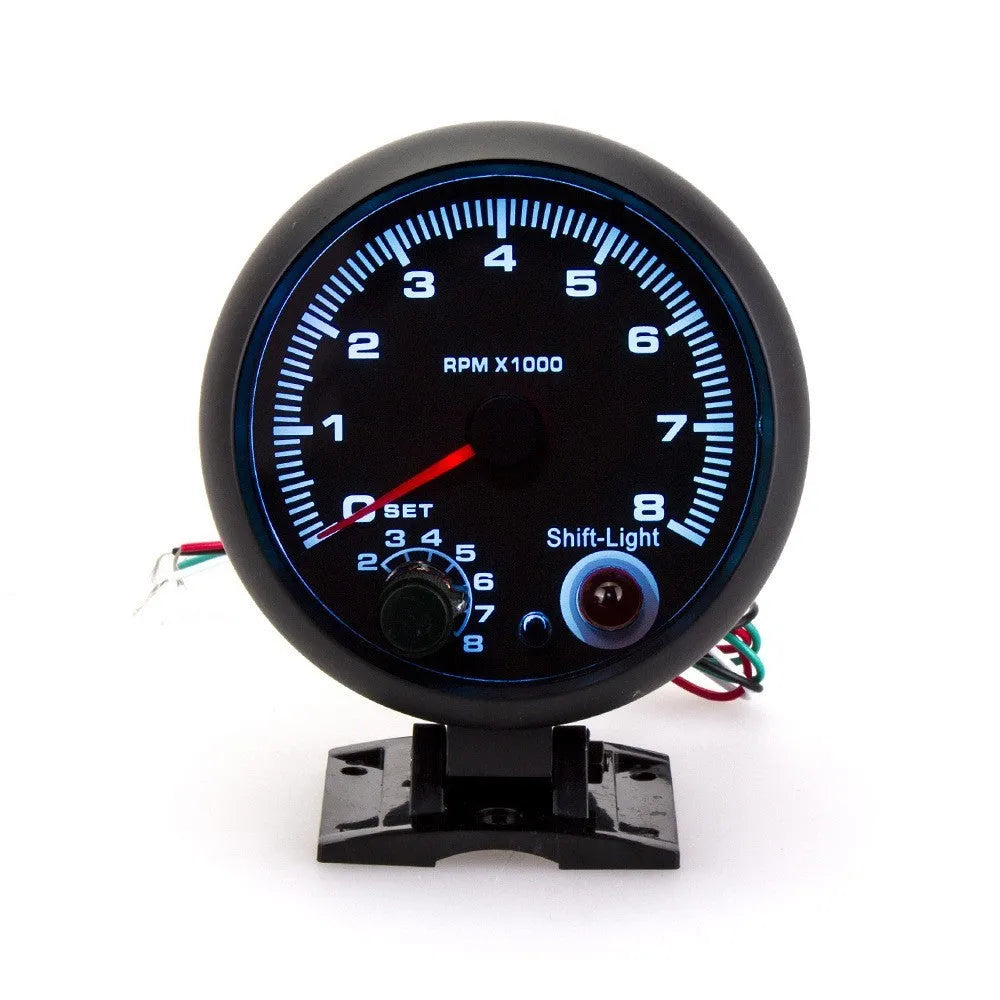 Black automotive tachometer with blue light pointer display for car engine RPM measurement