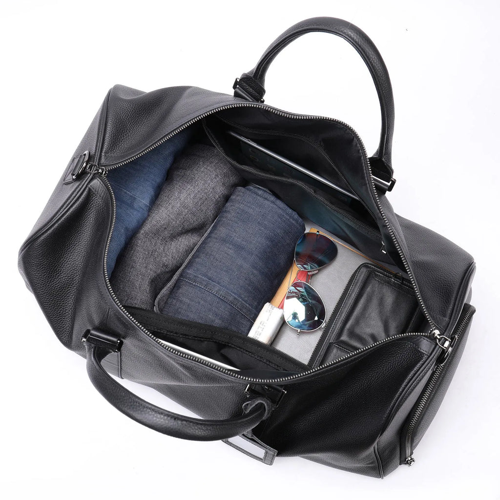 Men's black leather tote bag with single strap showing top-layer cowhide texture and generous capacity