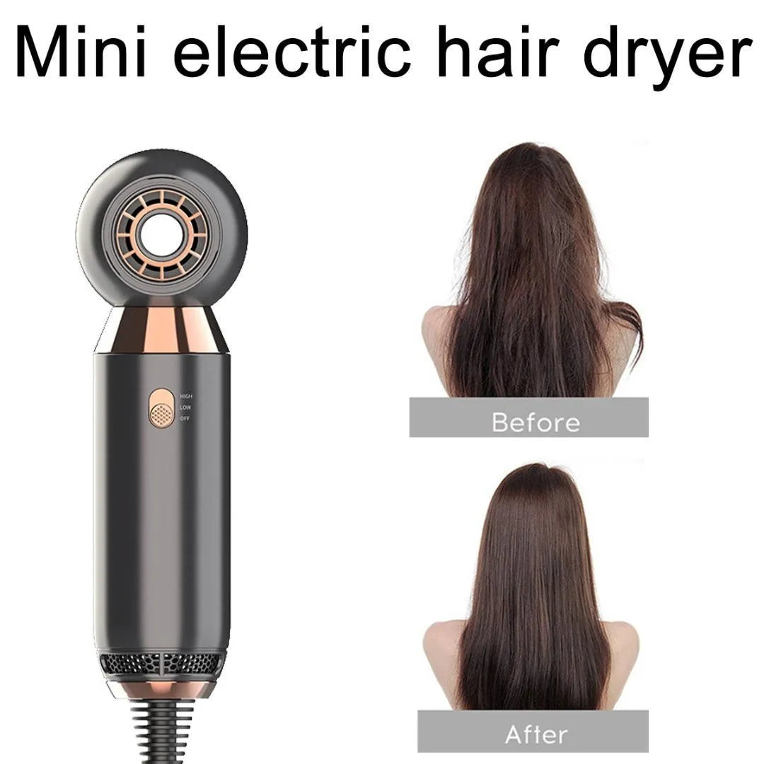 Compact white hair dryer with concentrator nozzle and diffuser attachment on a table.