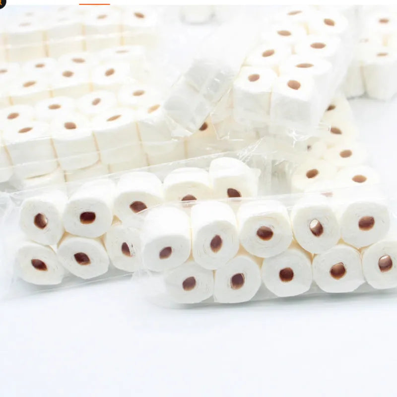 Miniature paper model of a toilet tissue roll for children's pretend play toys.