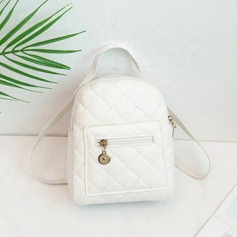 Hardback white PU girls backpack with embroidery, showing front sandwich pocket and soft carry handle.