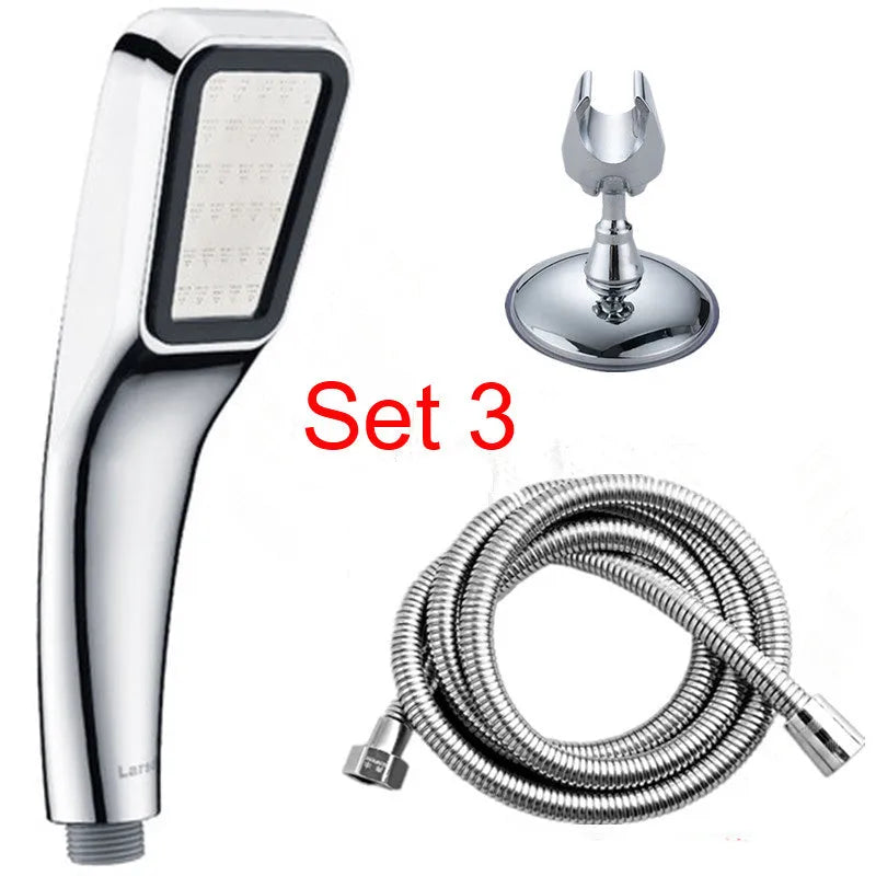 Hand-held pressurised rain shower head in orange and seven set configurations