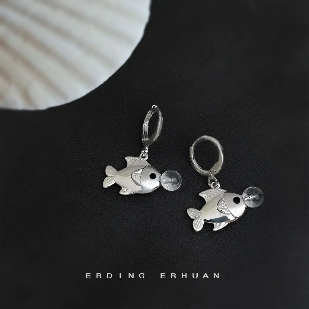A pair of copper bubble fish earrings with goldfish design and electroplated finish.