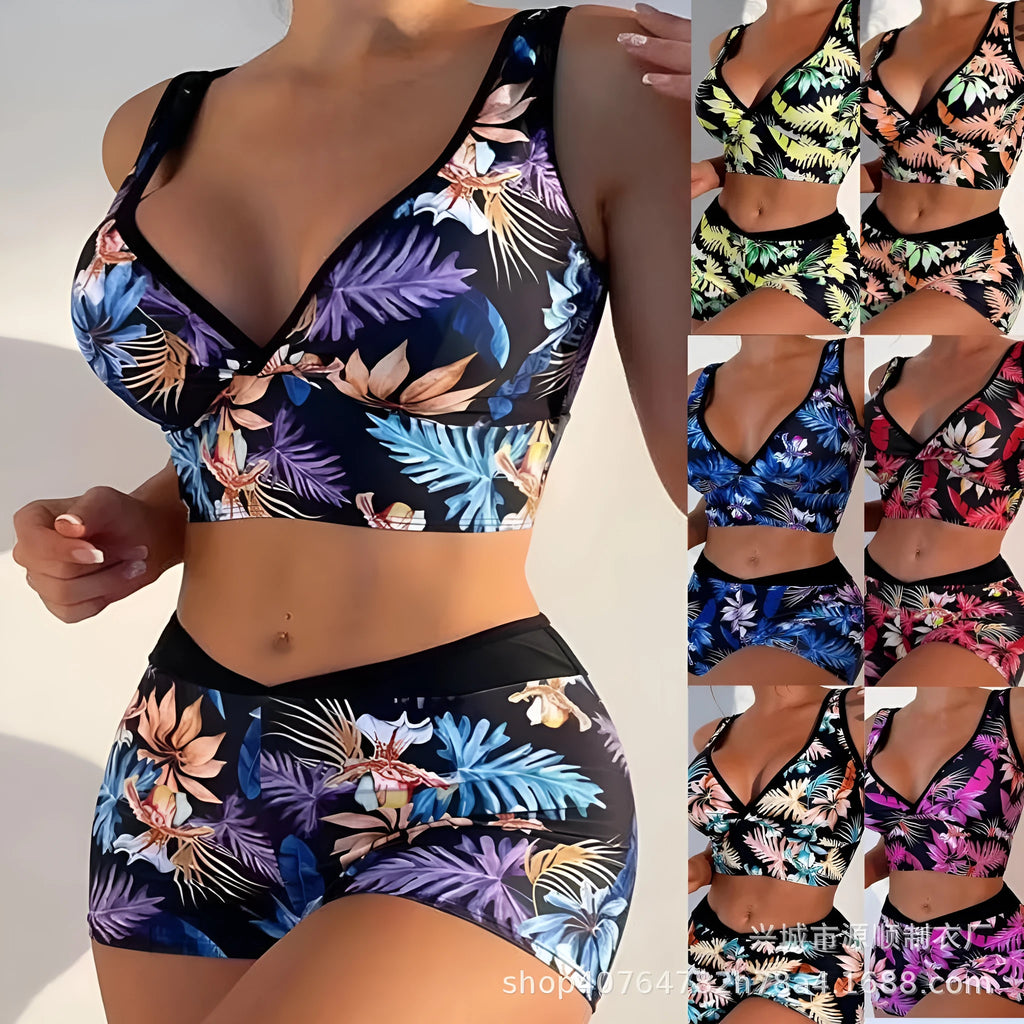 Women's two-piece swimsuit with sleeveless top and printed boxer brief bottoms in a multi-colour pattern.