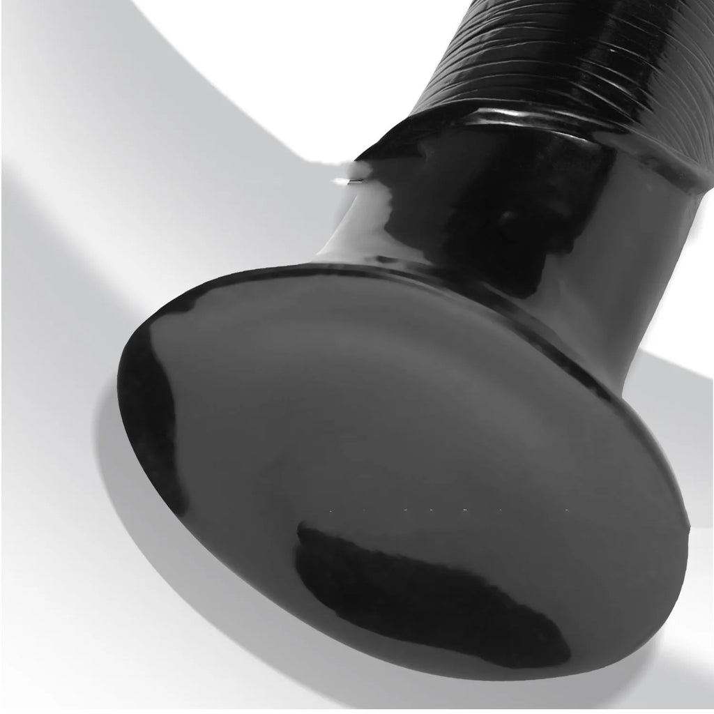 Black flesh colour PVC horsewhip with special-shaped super-long design on plain background