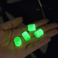 Glow-in-the-dark rubber car tyre valve caps in a set, showing size and luminous feature.