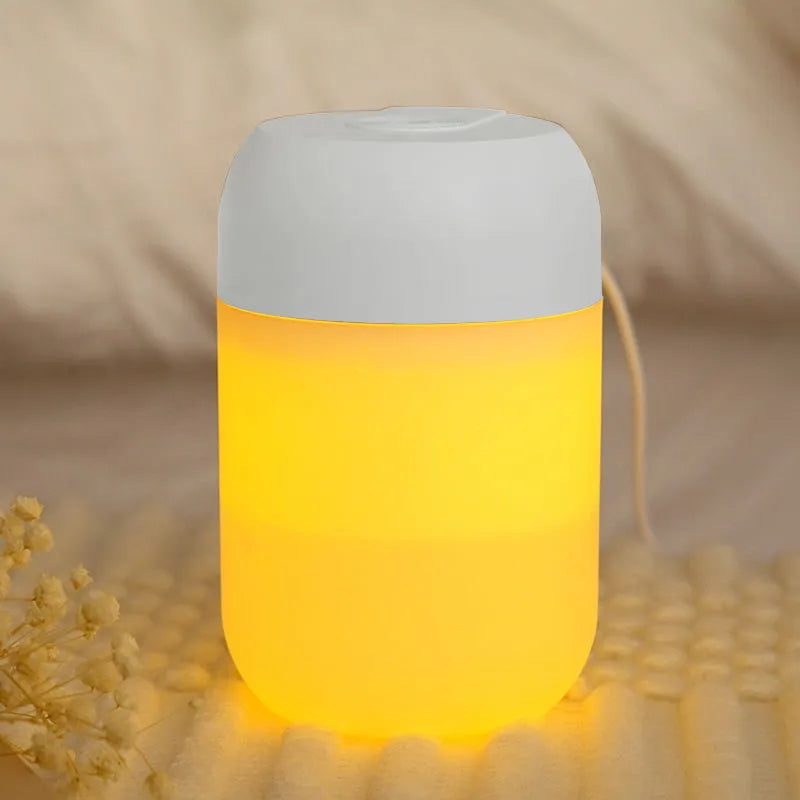 White cylindrical USB-powered mini humidifier with aromatherapy function on desk